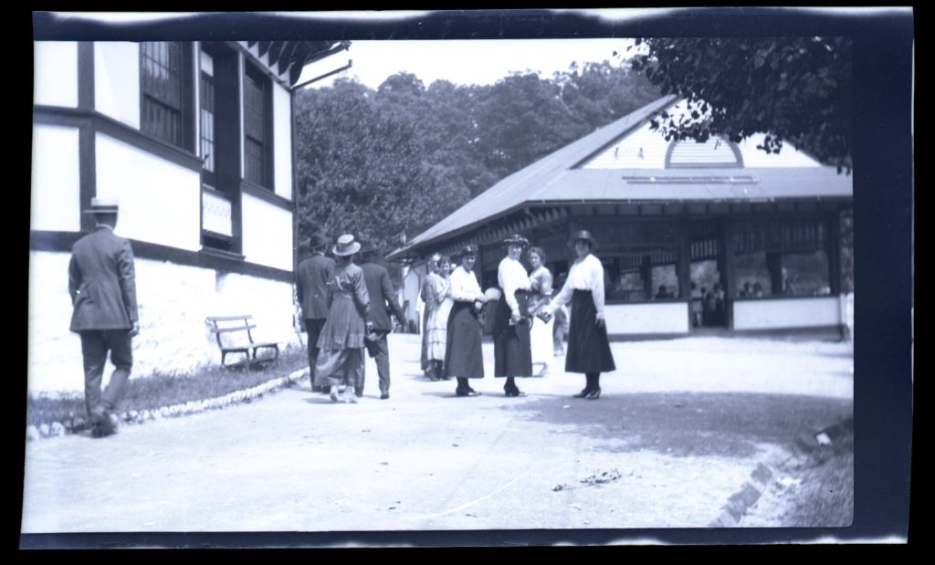 Family looking at camera with Oakford Park Restaurant in Background