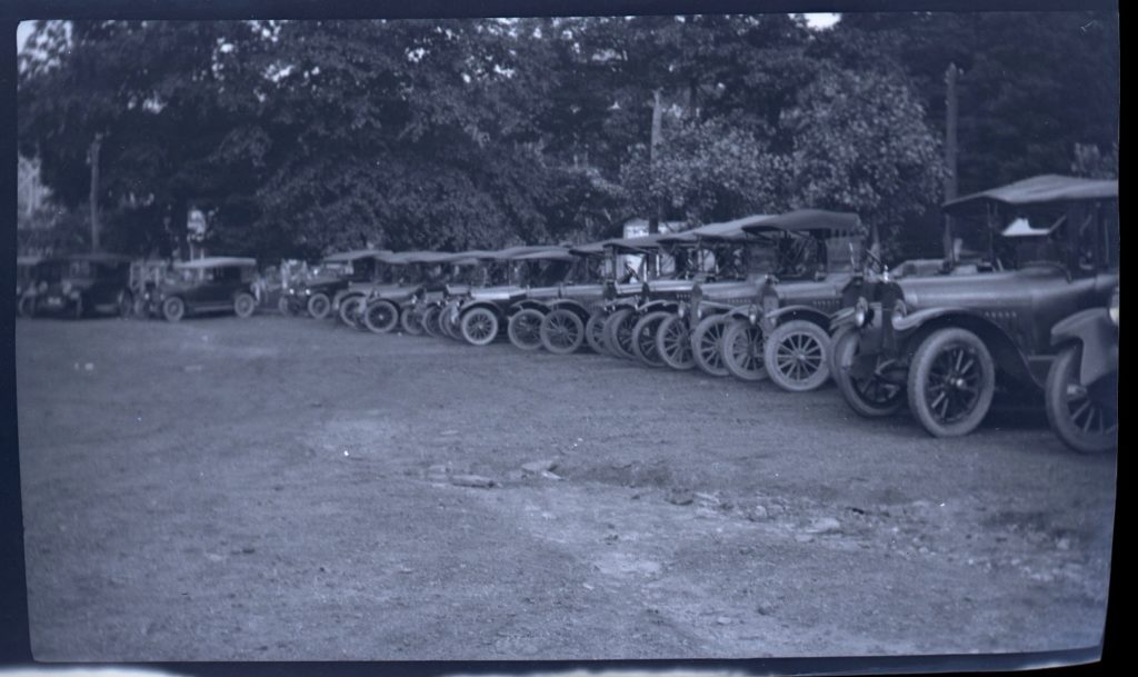 1920s era cars lined up in a "parking lot"