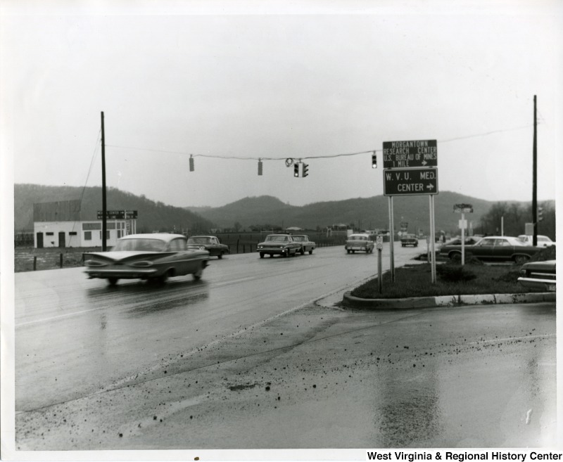 Cars driving through the intersection of Monongahela Boulevard and Patteson Drive in Morgantown, WV, 1966