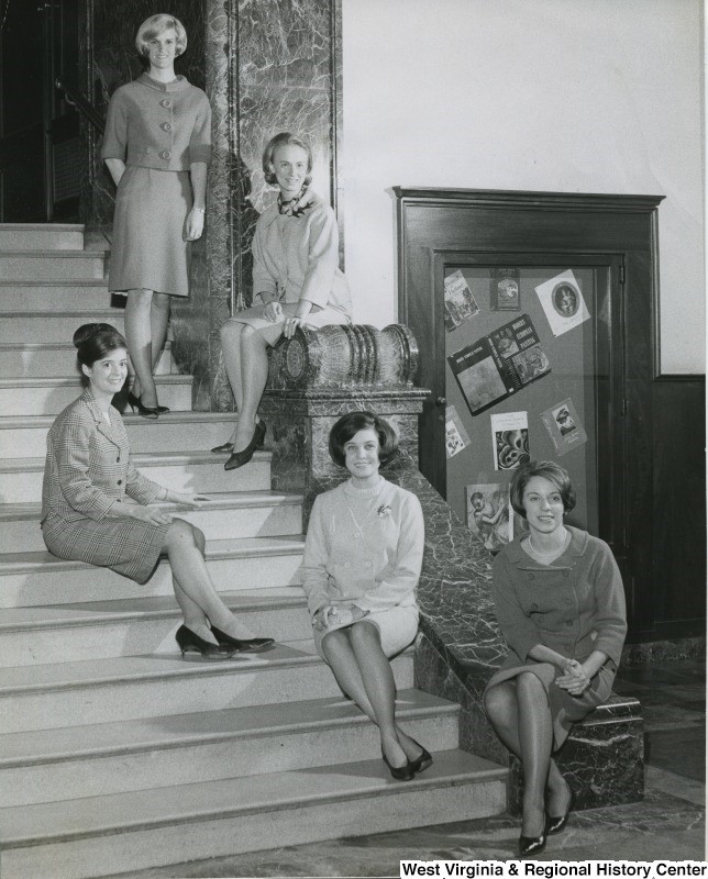 Women seated on stairs in WVU's Wise Library