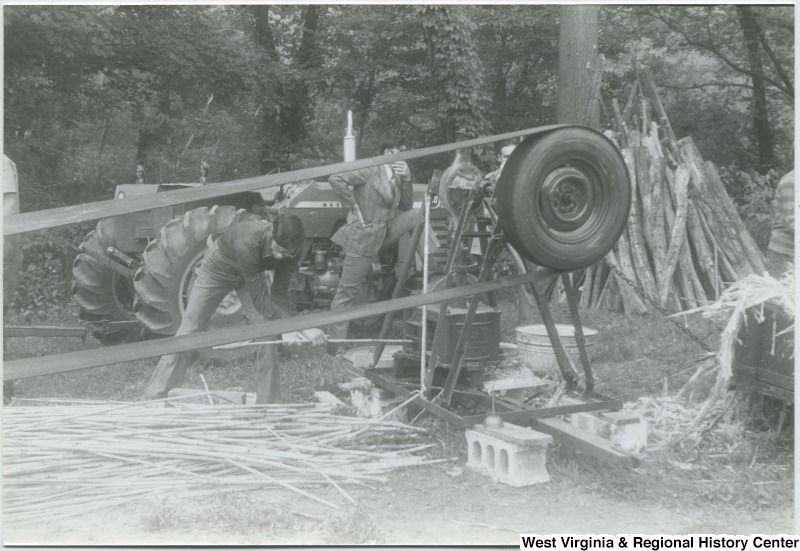 Men making cane molasses