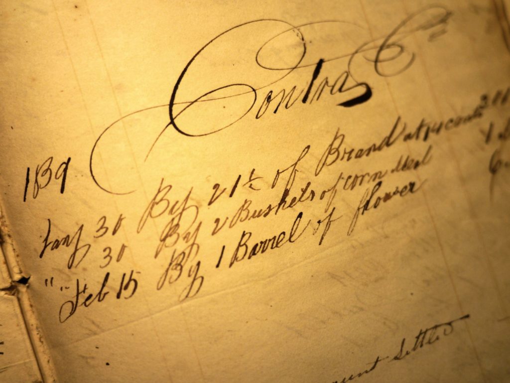 Record of Payment by Nimrod Dent for clothing, including bushels of corn and a barrel of flour