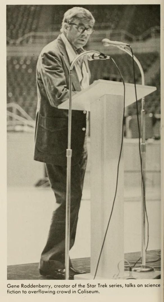 Gene Roddenberry standing at podium in WVU Coliseum