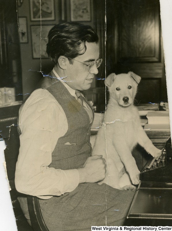 Senator Rush D. Holt With Dog on Lap at Typewriter