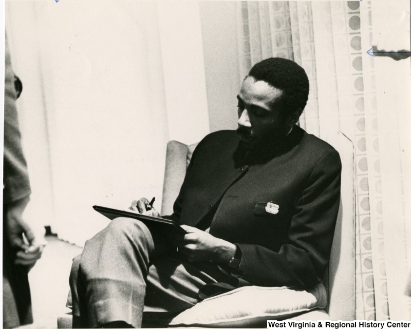 Comedian and Anti-War Activist Dick Gregory, seated