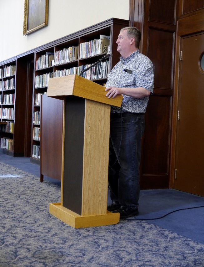 Professor Andy Duncan standing at a podium