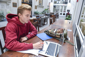 Student using laptop.