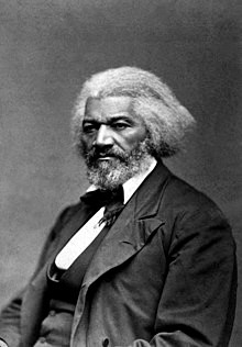 Black and white portrait photo of Frederick Douglass as an older man