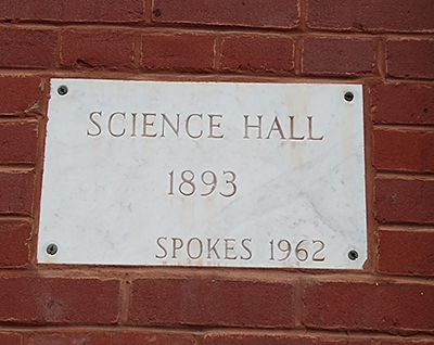 Plaque on bricks, "Science Hall / 1893 / Spokes 1962"