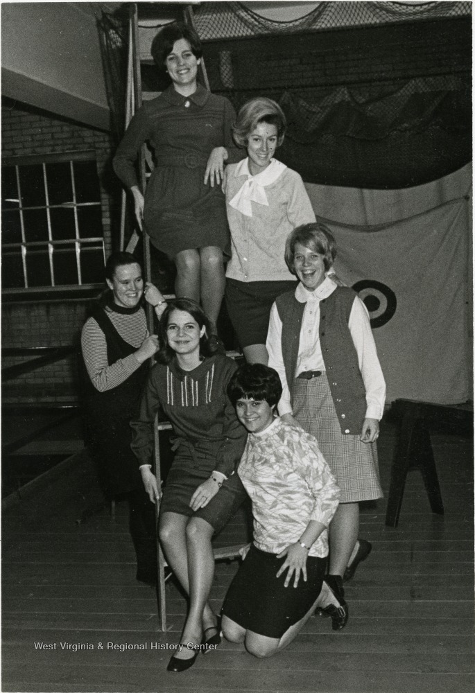 Interior group portrait of six college age women