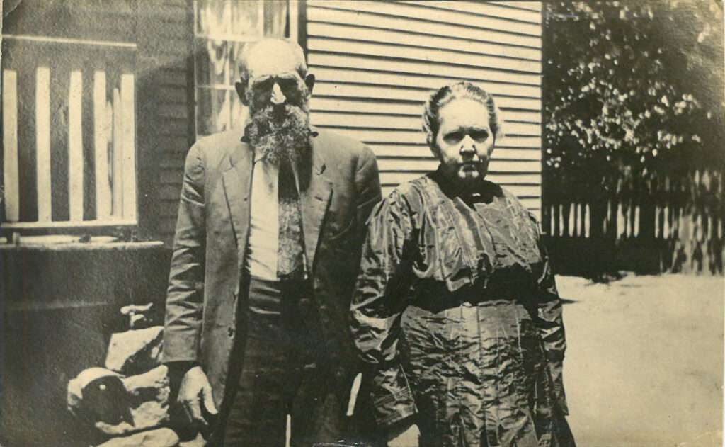 Man and woman standing outside a home