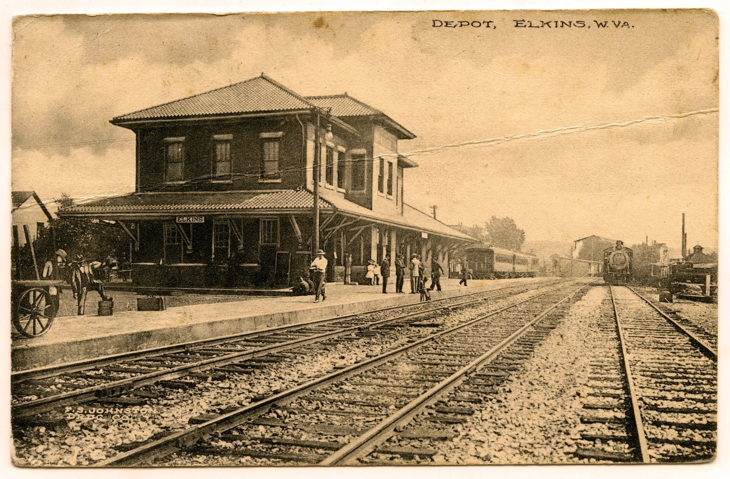 Sepia image of train depot, with some trains pulling in or out