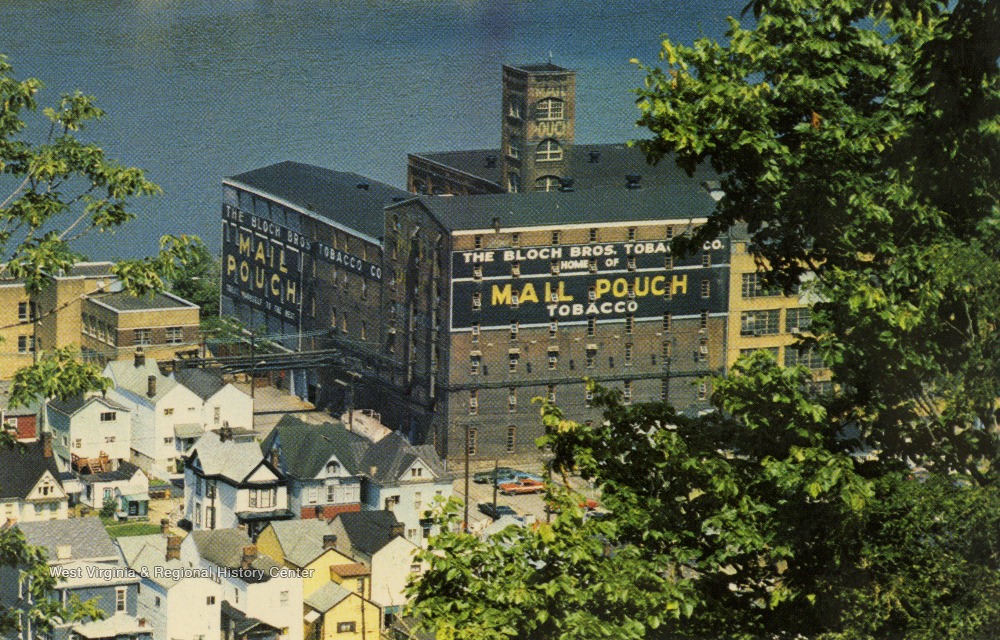 Warehouse or factory building with "Mail Pouch Tobacco" painted on the sides.