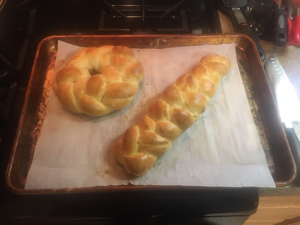 Ring and loaf of baked, braided dough