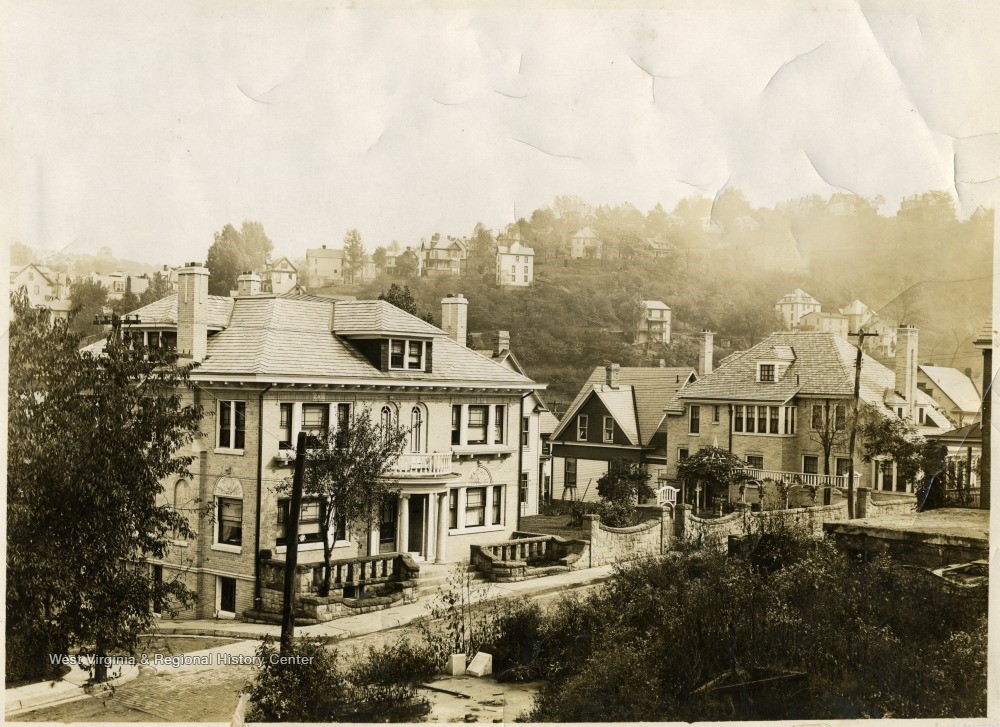 Two large homes along a street