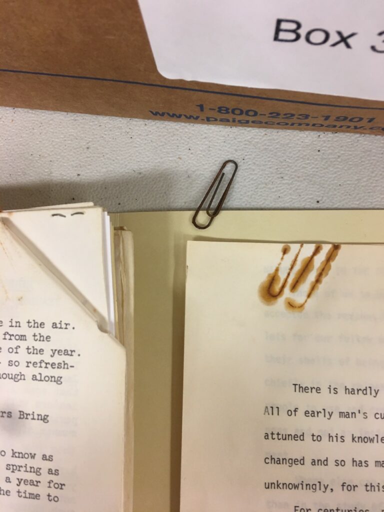 rusty paperclip and the rust marks that it left on a piece of paper