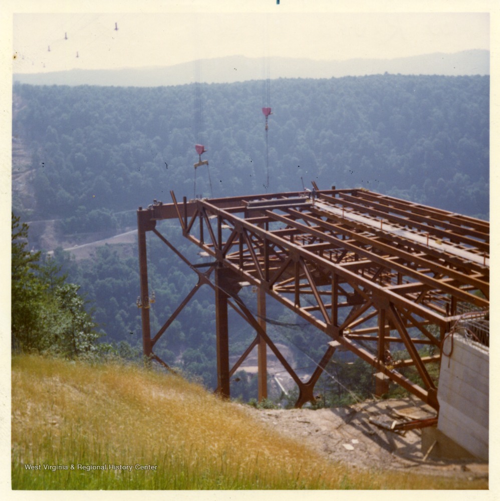 Part of a bridge construction of metal beams