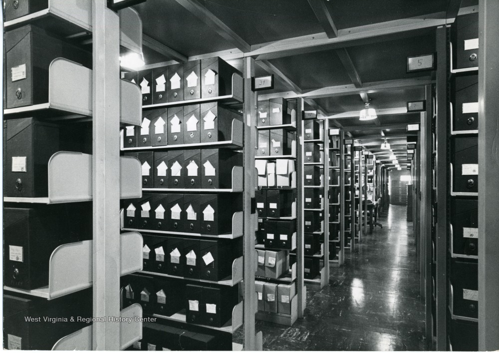 Rows of shelving filled with document cases