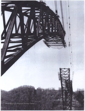 Two ends of New River Gorge bridge, with the middle missing, still under construction