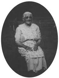 Mollie Gabe, seated