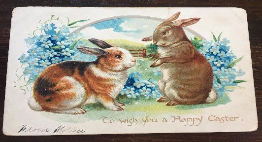 Happy Easter postcard featuring two bunnies
