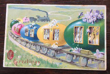 Easter postcard showing a train in which the cars are eggs and the passengers are bunnies