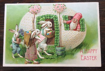 Easter postcard showing a person welcoming rabbits into his home, which is an egg