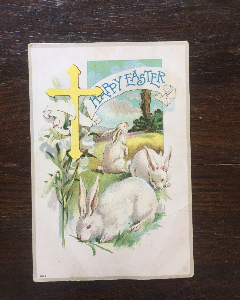 Easter postcard with a cross and bunnies