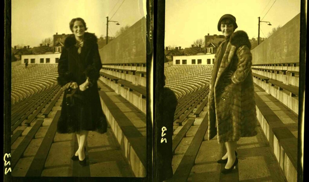 Two female students posing at Mountaineer Field