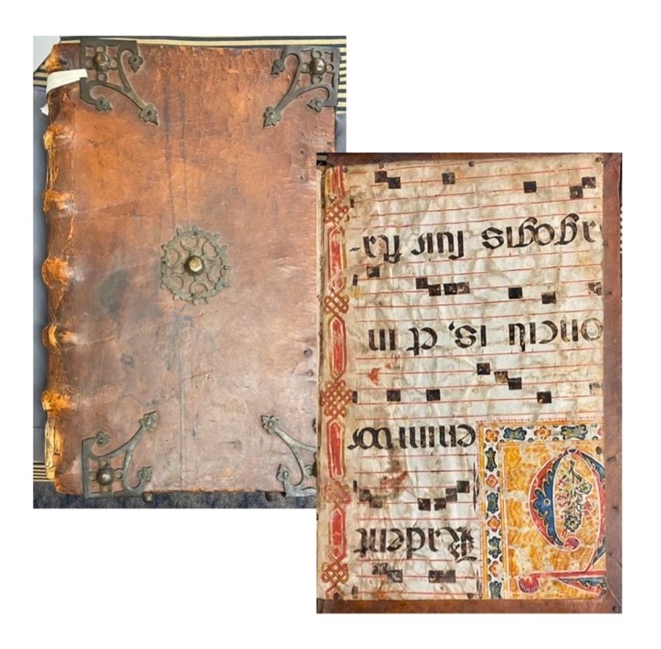 An old volume with a rich warm brown cover, decorated with metal corner adornments an a piece in the middle that resembles a gear. The the right is an image of black writing and an ornate decorate opening letter. 