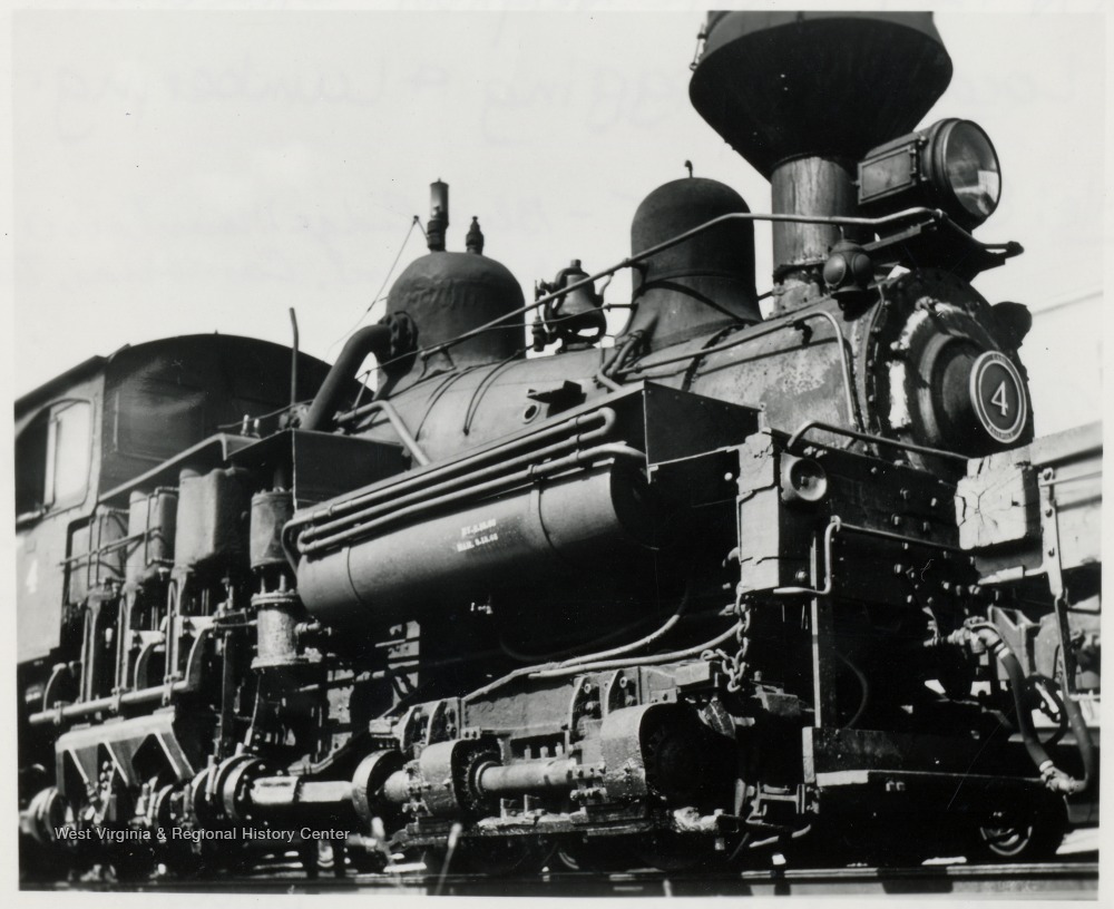 a close up picture of a train engine in black and white 