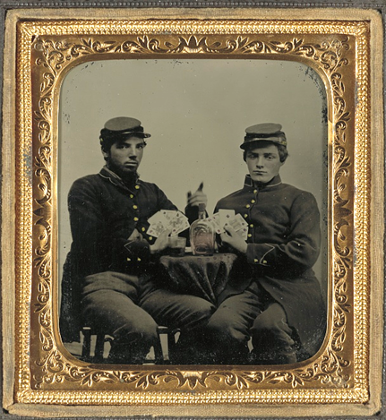  Two unidentified soldiers in Union uniforms drinking whiskey and playing cards.