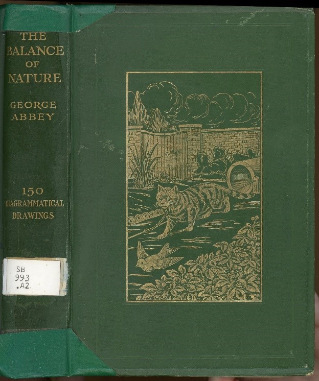 a deep green book with gold inlays illustrating a cat chasing a bird outside.