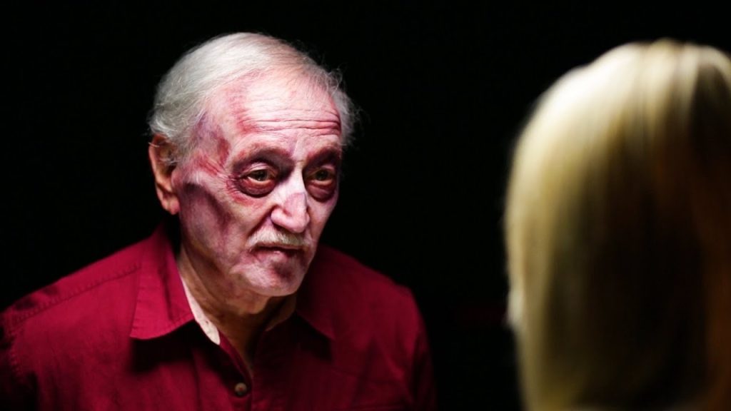 John Russo in red zombie makeup.